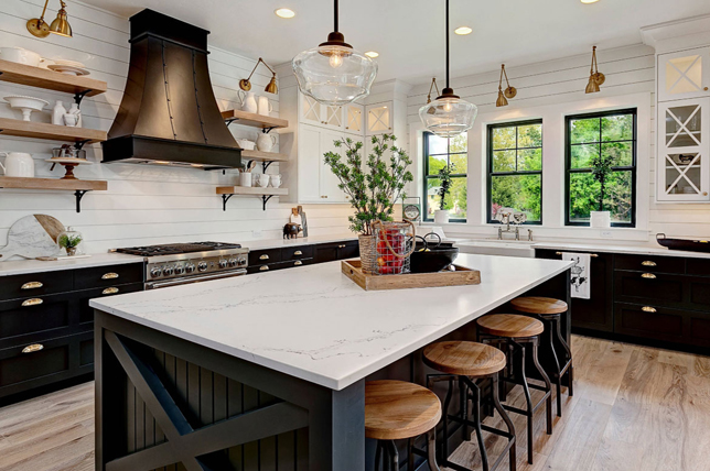 Stunning kitchen redesign featuring contrasting colors with dark kitchen cabinets for a true country farmhouse feel.